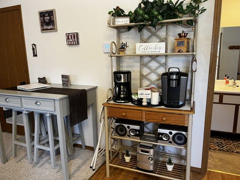 Coffee bar with drip coffee maker and Keurig.
