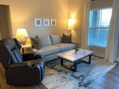 Comfortable spacious living room with Arhaus sofa and power recliner!