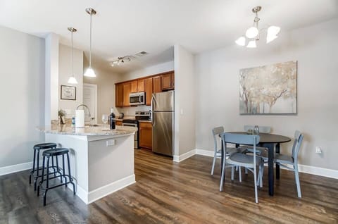 This apartment has a surprising amount of space and seating! Just in the kitchen and dining area alone, it will comfortable seat 6+.