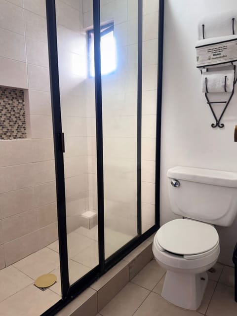 Suite, 1 King Bed (Master) | Bathroom | Shower, free toiletries, hair dryer, towels