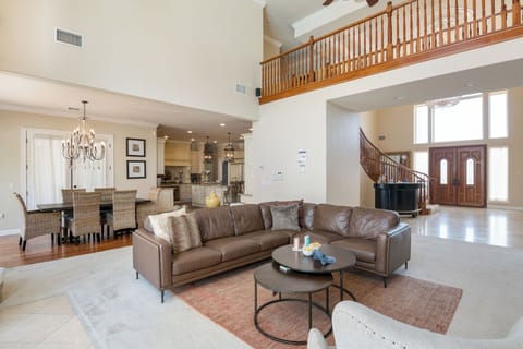 Main living room features leather couches.