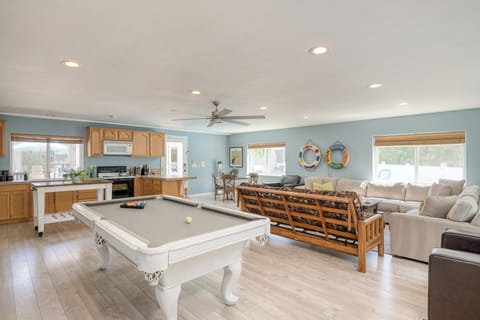 Living room in the guest house features a sitting area, pool table, dining area, and second kitchen.