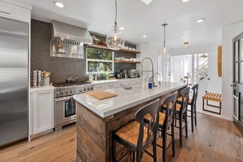 Sleek Gourmet Chef's Kitchen: Modern Design Meets Natural Light & Elegance