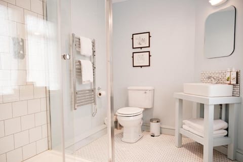 Shower, rainfall showerhead, hair dryer, towels