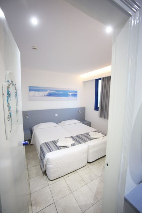Superior Room, Partial Sea View (2 Twin Rooms Interconnecting Door) | In-room safe, blackout drapes, soundproofing, iron/ironing board