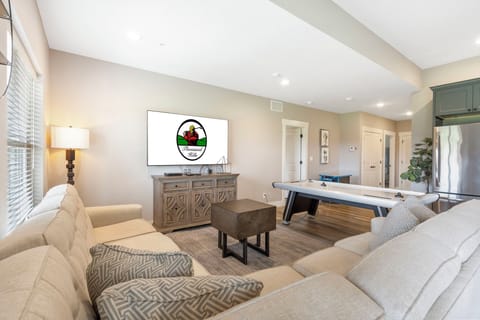 Downstairs Recreation room with Air Hockey and Sit Down Arcade, Galley Style Kitchen