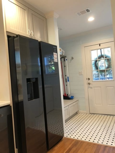 From the kitchen looking to the back door, that enters into laundry room.