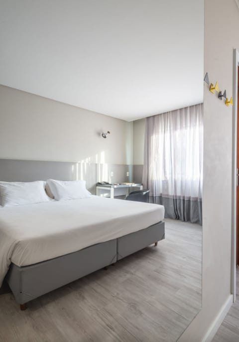 Standard Double or Twin Room | Minibar, in-room safe, blackout drapes, free WiFi