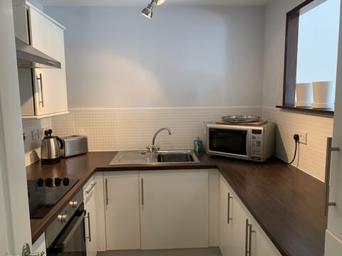 Apartment, 2 Bedrooms | Private kitchen | Fridge, microwave, coffee/tea maker