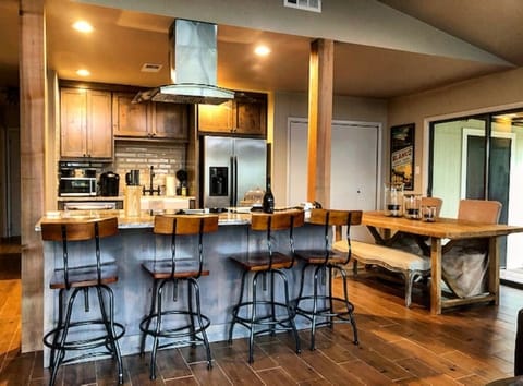 There are 4 barstools at the island and seating for 4 more at the table.