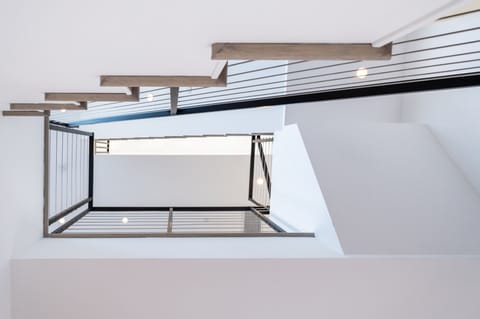 The house is 3 levels with a rooftop deck on the 3rd level