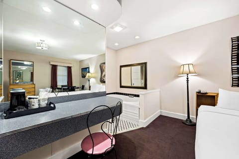 Suite, 1 King Bed, Non Smoking, Jetted Tub | Individually decorated, desk, blackout drapes, iron/ironing board