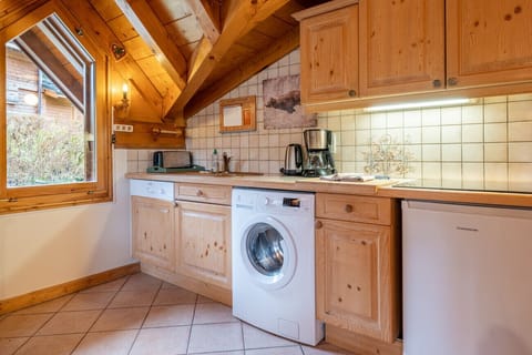 Open plan kitchen, fully equipped with an electric cooker, small oven and dishwasher
