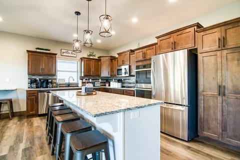The oversized kitchen island will be the perfect place to prep for any home cooking!