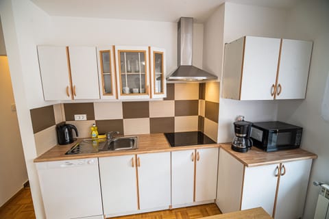 Apartment (One bedroom Apartment 1) | Private kitchen | Fridge, microwave