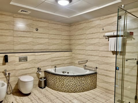 Executive Suite, 1 King Bed, Lagoon View | Bathroom | Combined shower/tub, deep soaking tub, eco-friendly toiletries