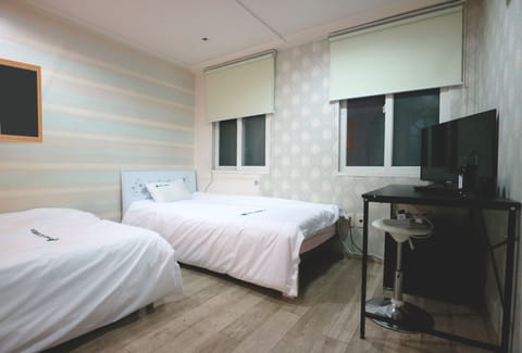 Triple Room, Shared Bathroom | Desk, laptop workspace, iron/ironing board, free WiFi