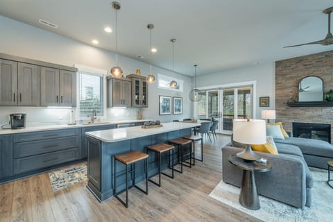 Open living, dining, and kitchen on the main level.