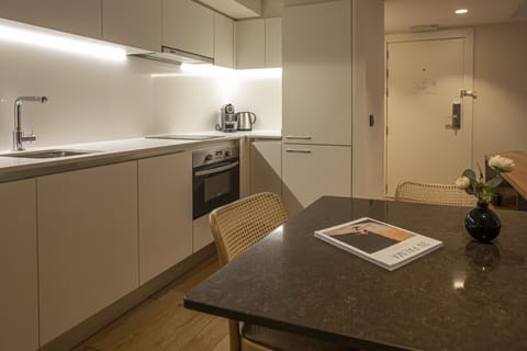 Premium Deluxe Suite | Private kitchen | Full-size fridge, microwave, stovetop, dishwasher