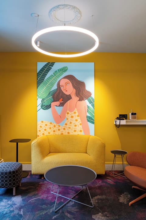 BOUTIQUE Suite with balcony | Living area | 22-inch flat-screen TV with satellite channels, TV, heated floors