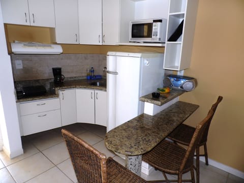 Luxury Apartment, Sea View | Private kitchenette | Full-size fridge, microwave, stovetop, cookware/dishes/utensils