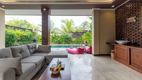 One Bedroom Seaview Pool Villa | Living area | 50-inch Smart TV with cable channels, TV