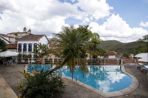 Indoor pool, pool umbrellas, sun loungers