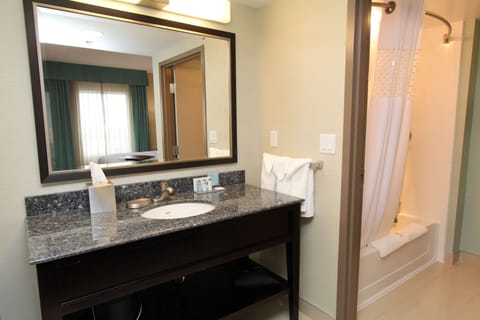 Studio Suite, 1 King Bed | Bathroom | Combined shower/tub, hair dryer, towels