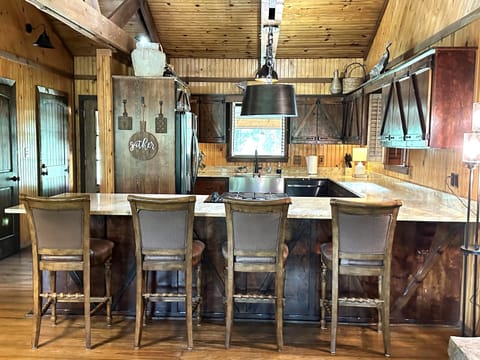 Bar seating between the living room and kitchen