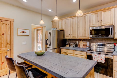 Kitchen island and a well stocked kitchen with all you need to cook