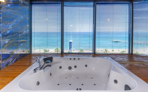 Exclusive Room, Sea View | Bathroom | Shower, hair dryer, slippers, towels