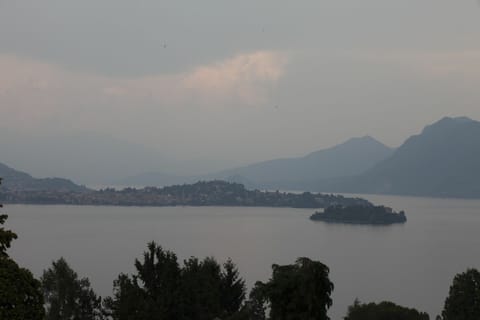 Cloud, Water, Sky, Water Resources, Atmosphere, Mountain, Tree, Highland, Lake, Coastal And Oceanic Landforms