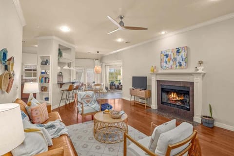 Open concept living & dining area – enjoy an open concept space ideal for gathering, with plush seating, smart TV and a seamless flow into the sunroom.