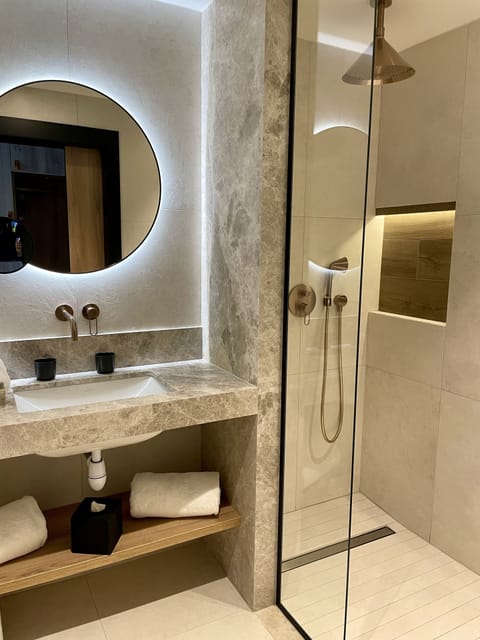 Designer toiletries, hair dryer, towels, soap