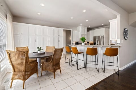 Next to this living room is a secondary dining space that seats 4 + 4 barstools at our kitchen bar.