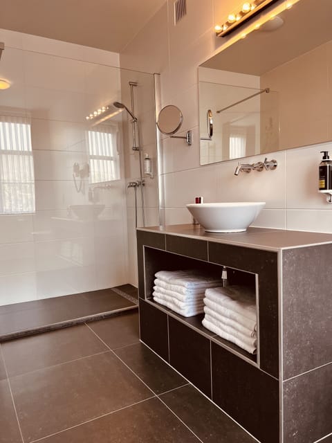 Designer toiletries, hair dryer, bathrobes, towels