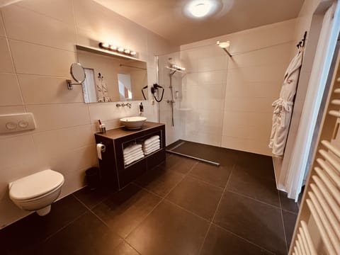 Designer toiletries, hair dryer, bathrobes, towels