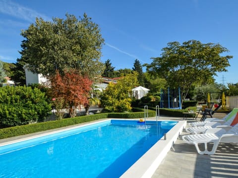 Water, Sky, Plant, Property, Swimming Pool, Azure, Tree, Body Of Water, Shade, Outdoor Furniture