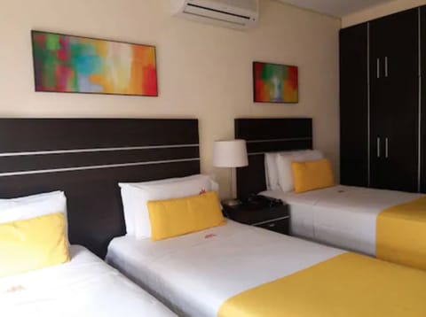 Standard Triple Room, 3 Twin Beds | Minibar, in-room safe, individually decorated, individually furnished