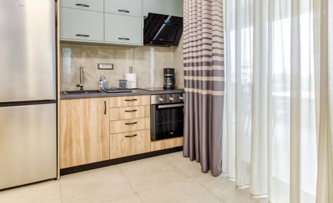 Suite, 2 Bedrooms, Partial Sea View | Private kitchen | Fridge, oven, stovetop, espresso maker