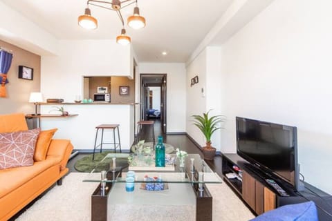 Apartment, Non Smoking | Living area | Flat-screen TV