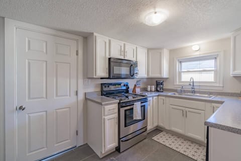 Traditional drip coffee maker, electric range, and over the range microwave!