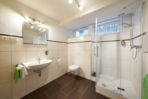 Apartment, 1 Bedroom | Bathroom | Shower, free toiletries, hair dryer, towels