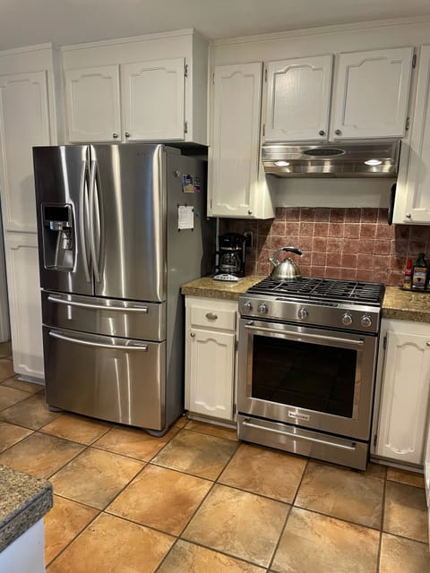 French door refrigerator and gas range