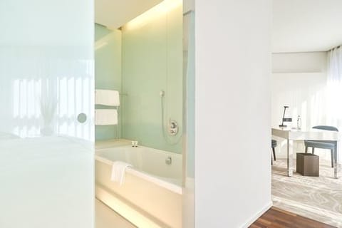 Executive Room | Bathroom | Designer toiletries, hair dryer, bathrobes, slippers