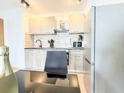 Flooring, Furniture, Kitchen, Countertop, Interior Design, Wood, Floor, Cabinetry, Kitchen Appliance, Major Appliance