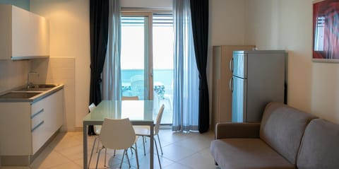 Apartment, 1 Bedroom, Balcony, Sea View | Living area | TV