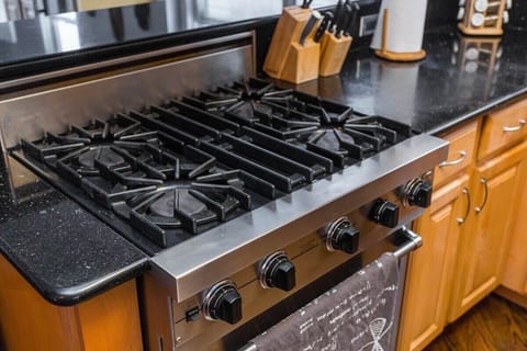 High end kitchen complete with stainless steel appliances is perfect for guests who enjoy cooking