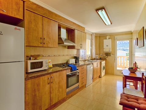 Cabinetry, Countertop, Furniture, Property, Kitchen Appliance, Kitchen Stove, Window, Kitchen, Wood, Interior Design