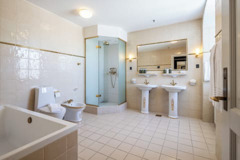 King's Suite | Bathroom | Designer toiletries, hair dryer, bathrobes, towels